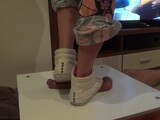 Girl in sneakers trample on cock and balls. Ends bootjob and cumshot