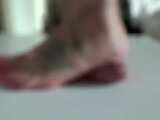 Beautiful, tattooed feet trample the cock and balls