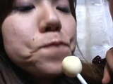 3 cute Japanese girls licking lollypops