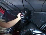 Latex Mistress whips tied up rubber sissy slave in dungeon