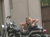 Hot girl on motorbike teases with her ass