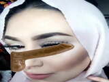 Hijabi rubs cock on face